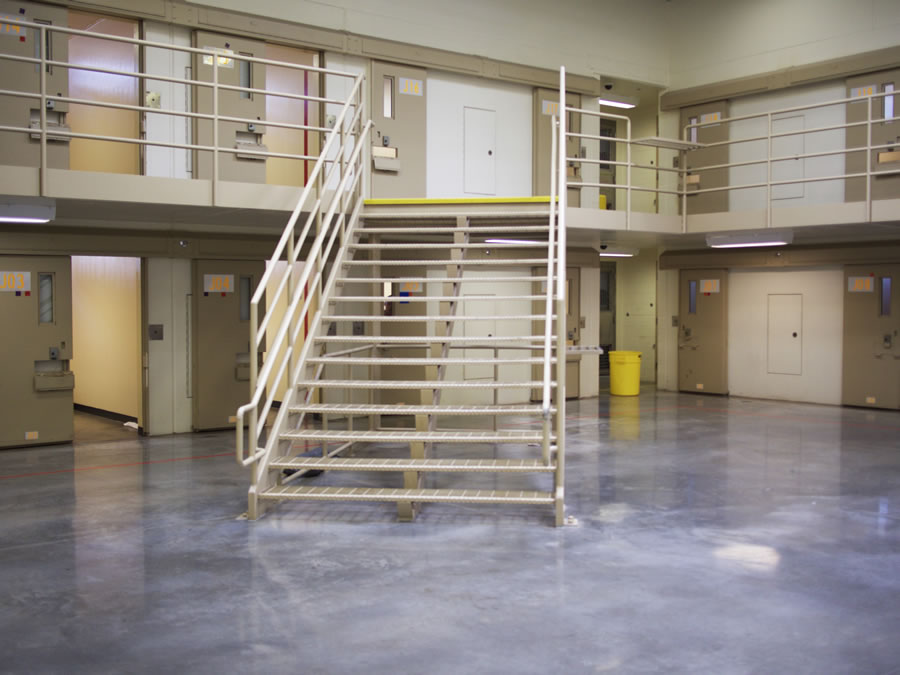 Inside of an empty prison cell block